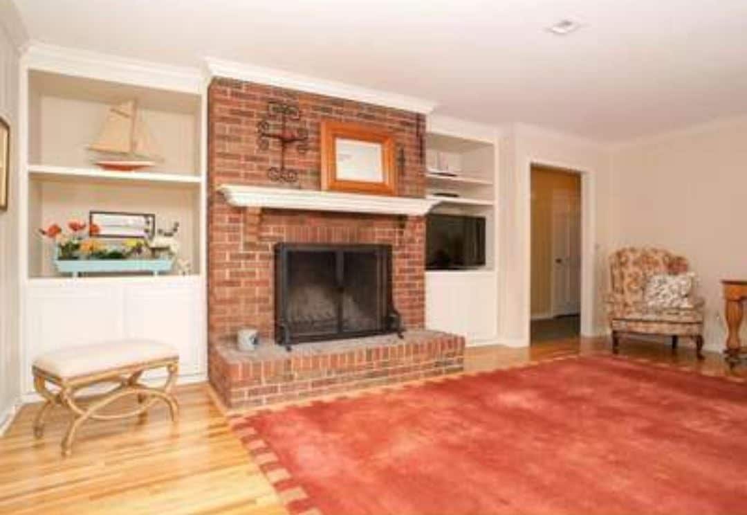 Complete Fireplace Redesign No More Brick Hearth Built Ins And Marble   Family Room Fireplace Before 