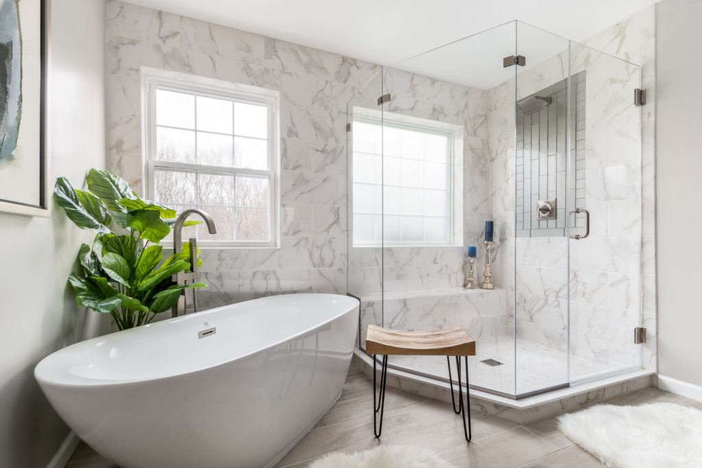 tile wall custom shower, freestanding tub,  with art
