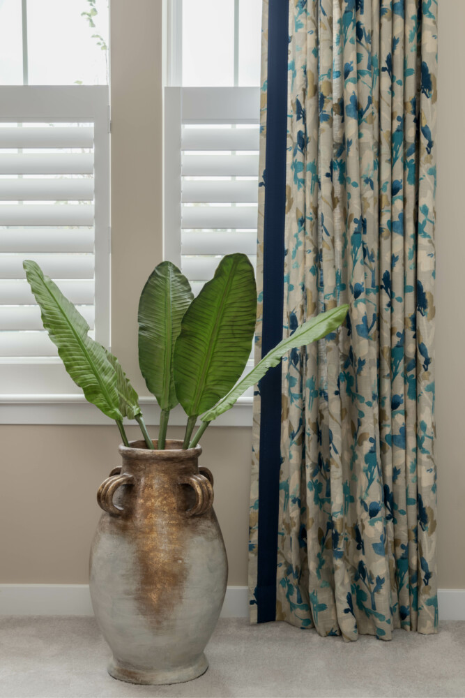 Details of custom drapes with tape and shutters