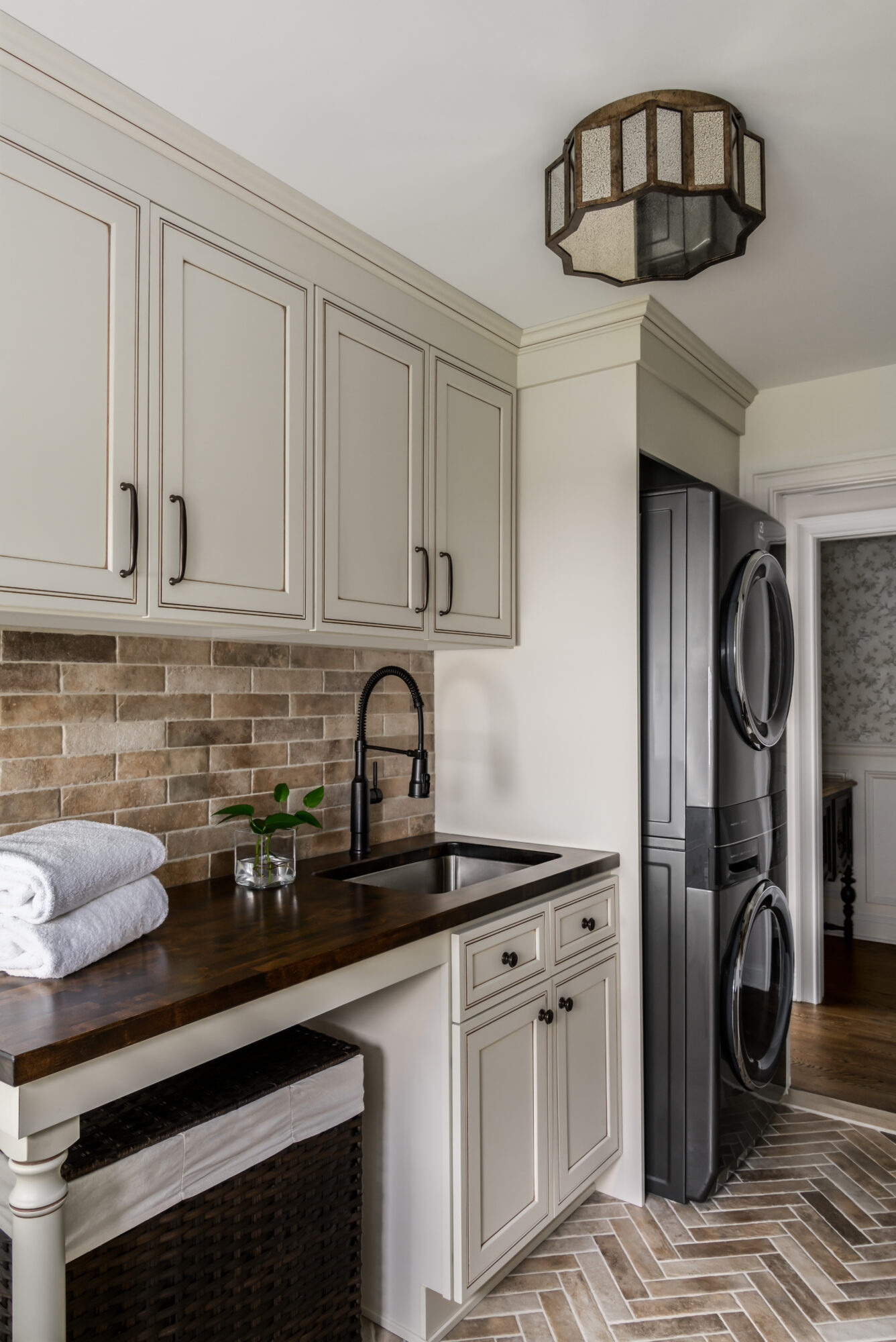 English style laundry room, Marlton, New Jersey, wood counter and French cream cabinets