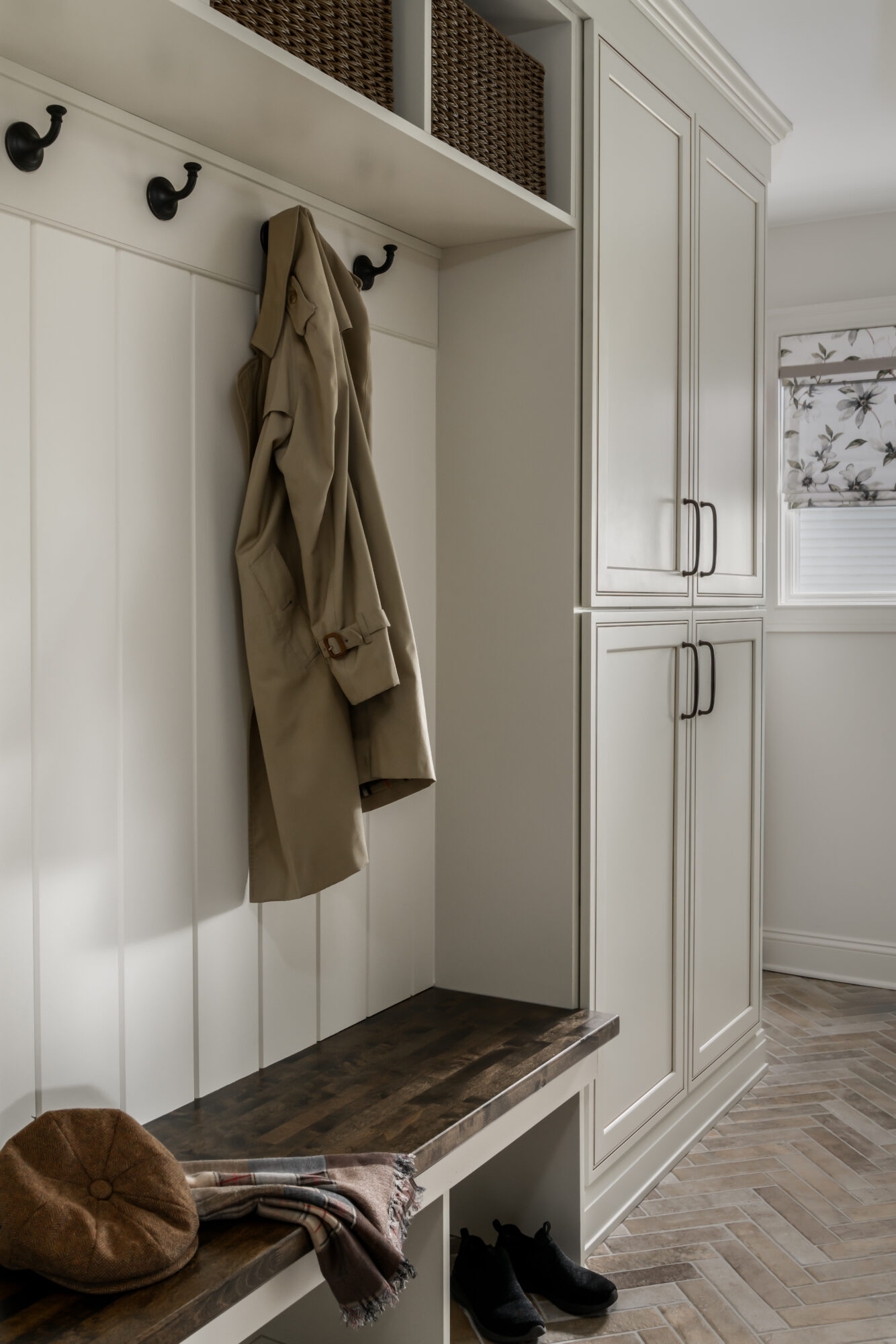 English style mud room with coat hooks, Marlton, New Jersey, wood bench, cream cabinets