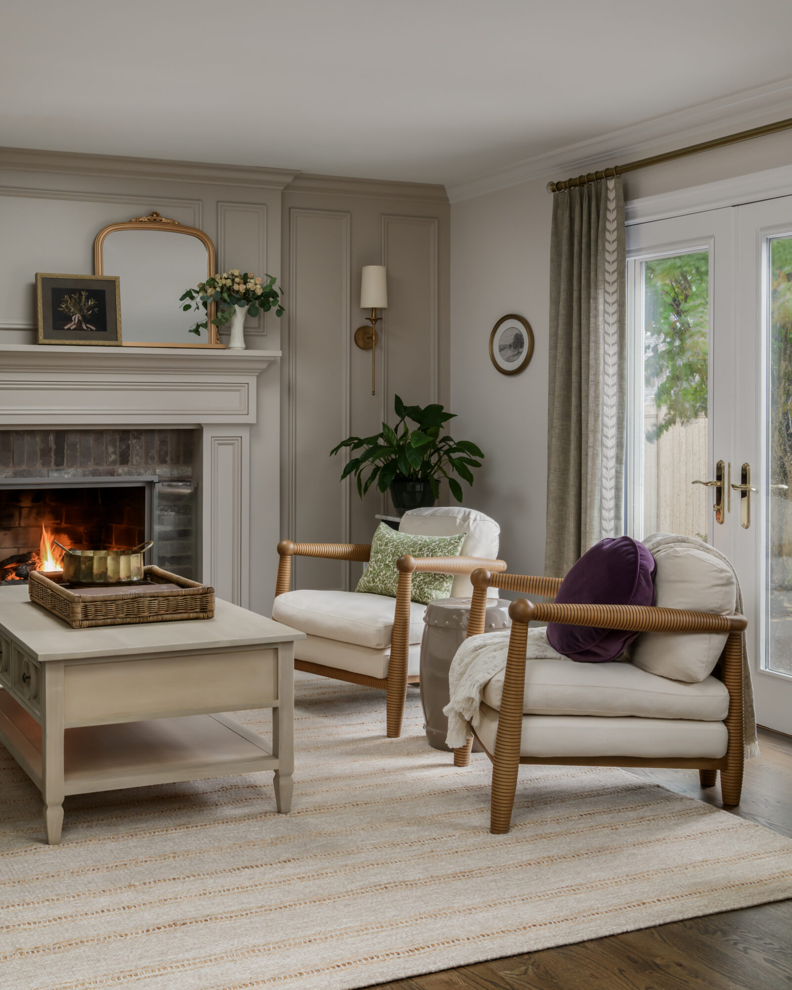 Modern English living room, in Marlton, New Jersey, with sixpenny gio chairs, mantle and shadowbox details