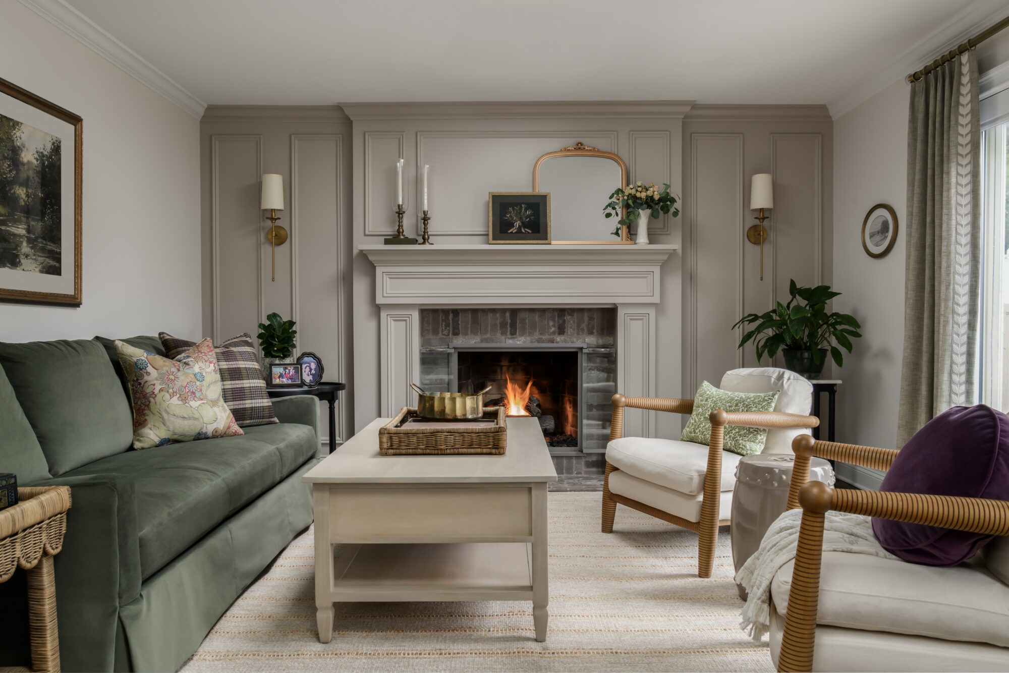 Modern English living room with green velvet sofa, double saturated detailed fireplace wall, Marlton, NJ