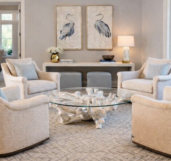 Coastal-sitting-room-with-neutral-chairs-round-glass-coffee-table